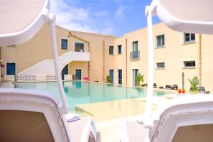 a view of a swimming pool in a building at Hotel Baglio Di Scopello in Scopello