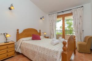 Posteľ alebo postele v izbe v ubytovaní Els Pins -Port d'Alcudia-