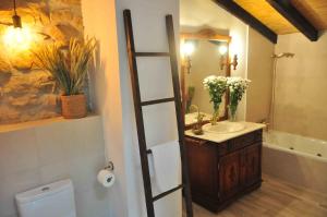 a bathroom with a sink and a mirror at CASA MENDILORE in Hondarribia +33 photos