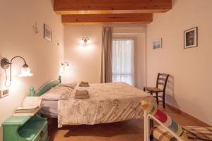 Ένα ή περισσότερα κρεβάτια σε δωμάτιο στο Agriturismo Case al Sole +81 φωτογραφίες