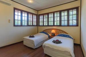 מיטה או מיטות בחדר ב-Elysia Nongsa 57 Batam Luxury Villa