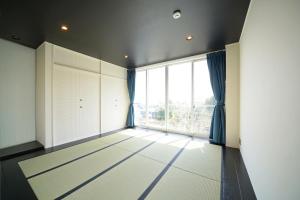 Foto sihtkohas Futo asuva majutusasutuse ファミーユ大室Ⅱ galeriist