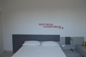 A bed or beds in a room at Casa Tua