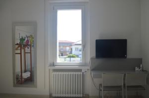 A television and/or entertainment centre at Casa Tua
