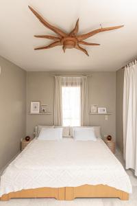 A bed or beds in a room at Helios Selene