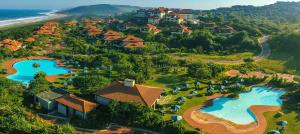an aerial view of a resort with two swimming pools at Zimbali Coastal Resort - ZKY1 - 3 Bedroom Apartment in Ballito
