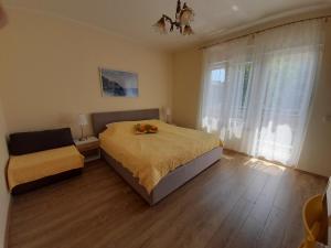Ένα ή περισσότερα κρεβάτια σε δωμάτιο στο Apartments Orange Lovran