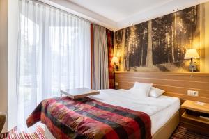 Postel nebo postele na pokoji v ubytování Hotel Warszawa Spa & Resort + 37 fotografií