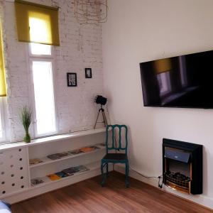 Televiisor ja/või meelelahutuskeskus majutusasutuses Centrum ARTLwowska +37 fotot