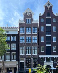 a building on the street in a city at Facade Hotel Amsterdam in Amsterdam