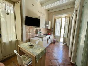 a kitchen with a sink and a stove top oven at A casa di Nicoletta in Tropea