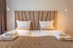 Postel nebo postele na pokoji v ubytování Ambria Apartments Matejki 17