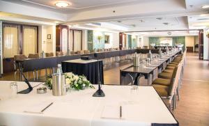 a row of tables and chairs in a room at AX The Victoria Hotel in Sliema