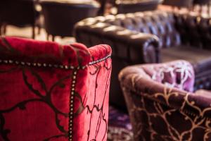 a row of leather seats in a theater at AX The Victoria Hotel in Sliema