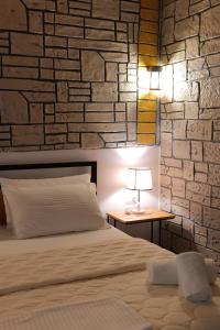 A bed or beds in a room at Oceanic Overview Suites