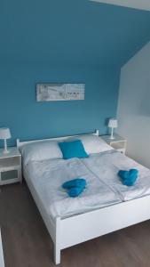 Cama o camas de una habitación en Ingrid Apartman