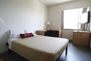 Postel nebo postele na pokoji v ubytování Résidences de l’Université d’Ottawa | University of Ottawa Residences
