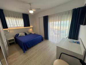 Posteľ alebo postele v izbe v ubytovaní Hotel Rio Mar