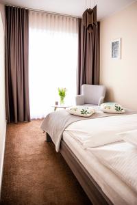 Postel nebo postele na pokoji v ubytování Apartament Bimba & Free Parking