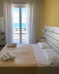 Postel nebo postele na pokoji v ubytování HOTEL FLYING