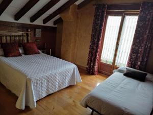 A bed or beds in a room at Camino a Casa - Suances