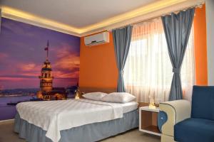 A bed or beds in a room at Elit Deniz Palamutbükü