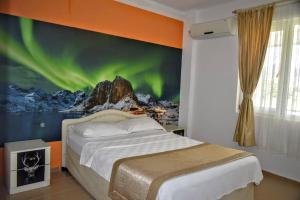 A bed or beds in a room at ELİT OTEL