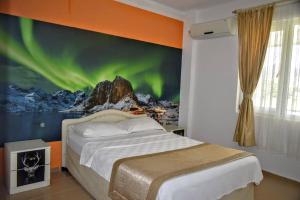 A bed or beds in a room at Elit Deniz Palamutbükü