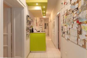 a hallway with a green counter in a room at Hostel Split Backpackers in Split