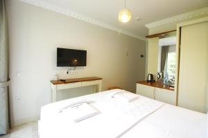 Postel nebo postele na pokoji v ubytování HOTEL DALYANCE
