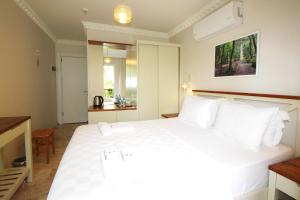 Postel nebo postele na pokoji v ubytování HOTEL DALYANCE