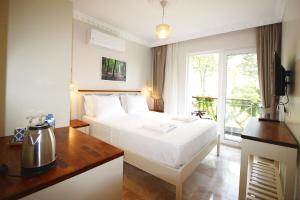 Postel nebo postele na pokoji v ubytování HOTEL DALYANCE