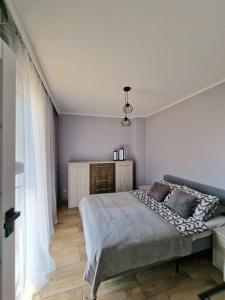 Posteľ alebo postele v izbe v ubytovaní Apartament z basenem i ogródkiem Baltic Sun A17
