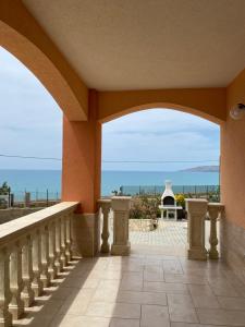 a balcony with a view of the ocean at Carrubella Santa Zita in Licata