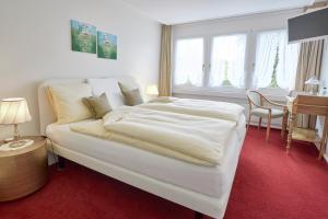 Voodi või voodid majutusasutuse Hotel & Spezialitätenrestaurant zur Linde toas