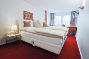 Voodi või voodid majutusasutuse Hotel & Spezialitätenrestaurant zur Linde toas