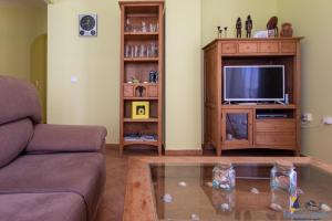 Телевизор и/или развлекательный центр в El Velero La Isleta Junto al Mar Buceo Parking