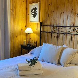 Ein Bett oder Betten in einem Zimmer der Unterkunft Fratelli Cabañas-Apart