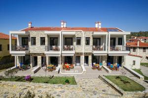 an aerial view of a building with a patio at Liotrivi Houses at Old Nikiti in Nikiti