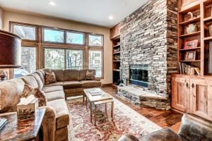 a living room with a couch and a fireplace at 22 Highlands Townhomes in Beaver Creek