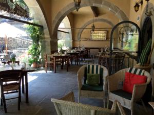 Restoran või mõni muu söögikoht majutusasutuses Locanda del Pellegrino