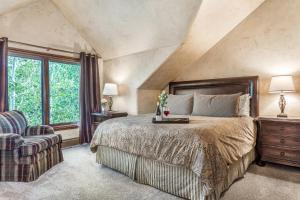 a bedroom with a large bed and a window at A6 Village Townhouse in Edwards +48 photos