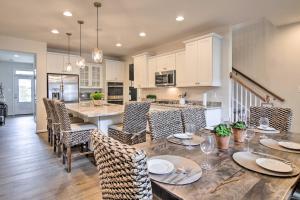 a kitchen and dining room with a table and chairs at 3 Mi to Bethany Beach Townhome with Fire Pit in Ocean View