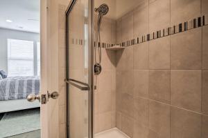 a shower with a glass door in a bathroom at 3 Mi to Bethany Beach Townhome with Fire Pit in Ocean View +33 photos