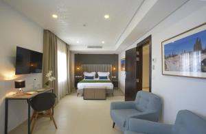 Postel nebo postele na pokoji v ubytování MAIA HOTEL SUITES + 37 fotografií
