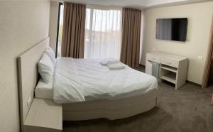 Postel nebo postele na pokoji v ubytování Hotel Alis