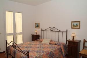 Postel nebo postele na pokoji v ubytování Agriturismo San Luigi