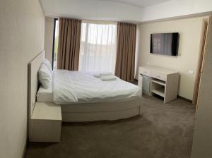 Postel nebo postele na pokoji v ubytování Hotel Alis