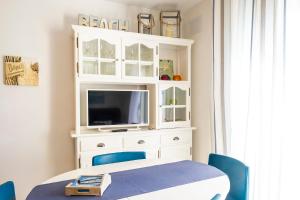 A television and/or entertainment centre at LIVE TAJAO BEACH
