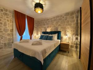מיטה או מיטות בחדר ב-Apartment Caserma